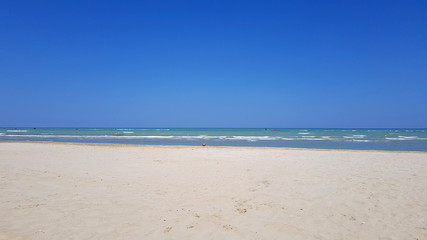 Fototapeta na wymiar A sunny day in summer of total relax on the italian adriatic beach