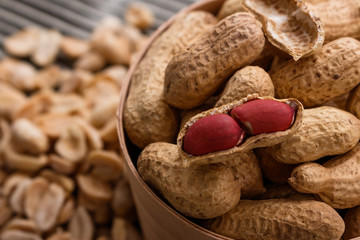 fresh peanuts on a wooden rustic background