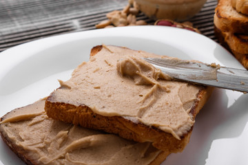 peanut paste on a wooden rustic background