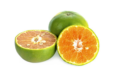 Fototapeta na wymiar green tangerine on white background.
