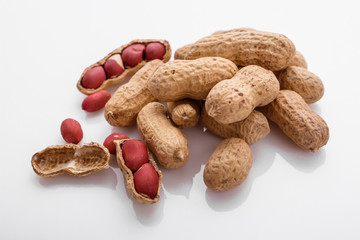 fresh peanuts on a white acrylic background