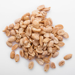 fresh peanuts on a white acrylic background