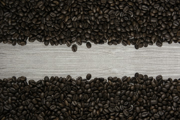 Top view of Coffee bean on grey wood background with space.
