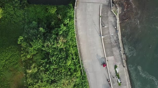 AERIAL SHOT: Puro and Lamba, Legazpi City, Philippines. Views of cocount trees, Mayon Volcano and the sea