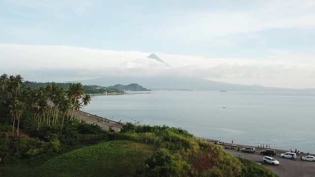 AERIAL SHOT: Puro and Lamba, Legazpi City, Philippines. Views of cocount trees, Mayon Volcano and the sea