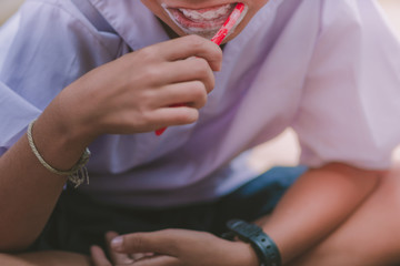Elementary Students brush their teeth after lunch at school.