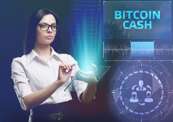 The concept of business, technology, the Internet and the network. A young entrepreneur working on a virtual screen of the future and sees the inscription: bitcoin cash