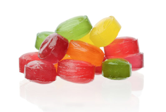 Heap of multicolored candies isolated