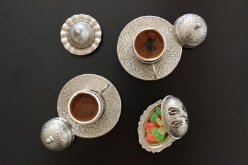Fresh hot turkish coffee with turkish delight.