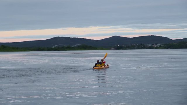 Two Men Tandem Kayak in Lake in Sweden