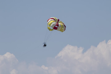 parasailing on a beautiful summer afternoon over a Wisconsin lake