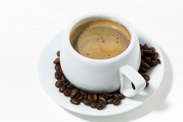 morning mug of coffee on a white background, top view