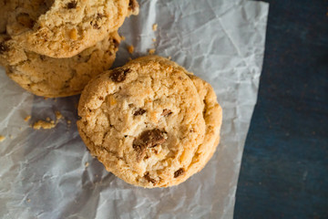 Biten biscuit cookie with almond on the table