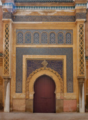 Fototapeta na wymiar Tall ornamented gate in Morocco