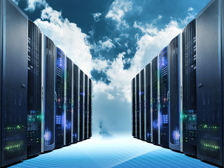 Cloud computing and computer networking concept: rows of network servers against blue sky with clouds