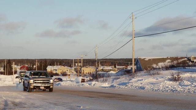 Winter traffic and power lines in the Cree town of Chisasibi, northern Quebec, winter