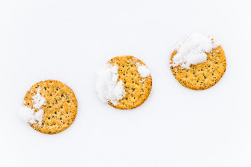 three multigrain crackers chill in fresh snow