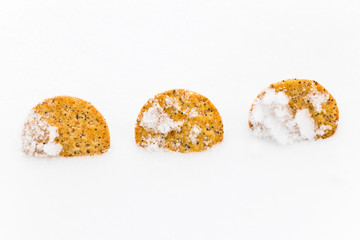 three multigrain crackers dipped in fresh snow