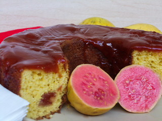 Typical Brazilian sweet dessert corn cake with guava paste. And guavas fruits  composing the scene.