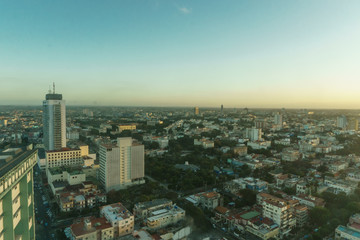 Fototapeta na wymiar beautiful aerial view of sunrise over a city full of buildings near the beach