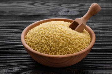 fresh couscous on a wooden rustic background
