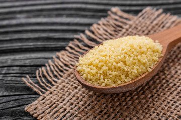 fresh couscous on a wooden rustic background