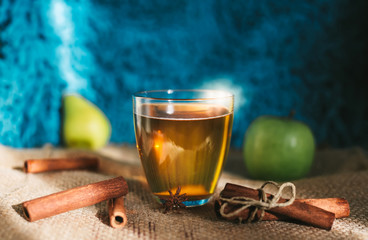 Hot apple cider beverage. Hot drink (apple tea, punch) with cinnamon stick and star anise on tote...