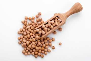 uncooked chickpeas on a white acrylic background