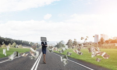Business woman with laptop instead of head.