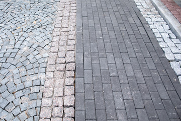 Different kind of pavement cobblestone on the street