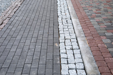 Different kind of pavement cobblestone on the street