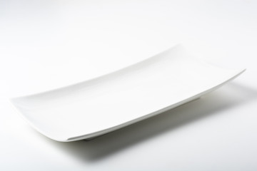 a white rectangular plate - obrazy, fototapety, plakaty