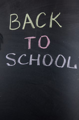 Fototapeta premium Chalk title Back to school on blackboard