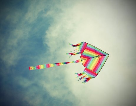 big kite flies in the sky with vintage old effect