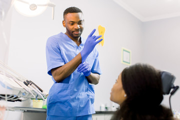 dentistry student black man dentist standing in a dental treatment room