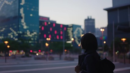 portrait of young muslim women excited enjoying viewing urban city skyline lights wearing headscarf