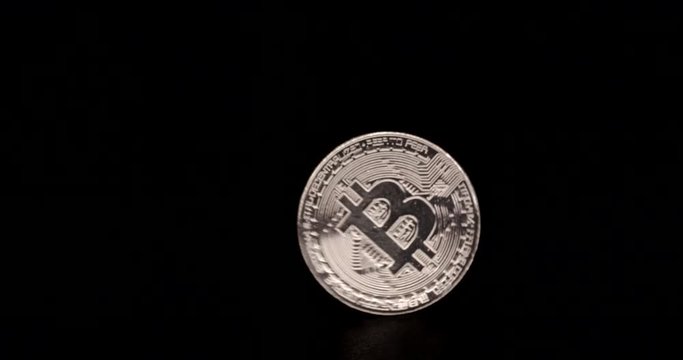 Bitcoin spinning on black background
(slow motion)