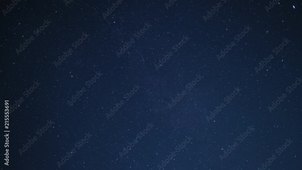 Wall mural timelapse of beautiful night sky with stars moving slowly, background in 4k uhd