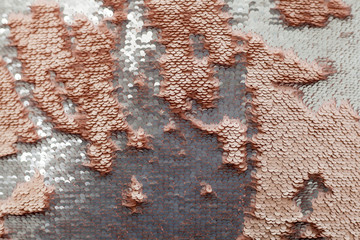 Sequins close-up macro. Abstract background with gold sequins color on the fabric.