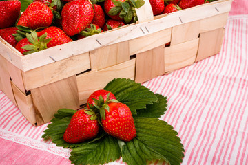 Juicy fresh strawberries in a wooden basket