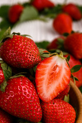 Juicy fresh strawberry on a rustic wooden background