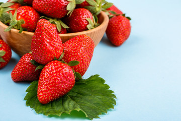 juicy fresh strawberry on a delicately blue background