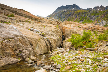 Small waterfall in mountain of Svartisen parkland in Norway
