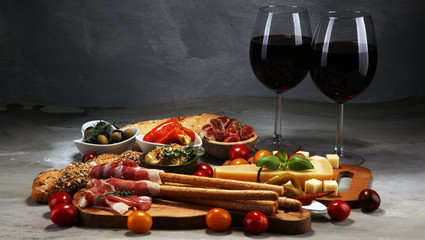 Italian antipasti wine snacks set. Cheese variety, Mediterranean olives, crudo, Prosciutto di...