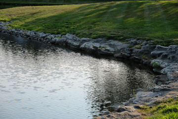 Rocks along the tranquil lake