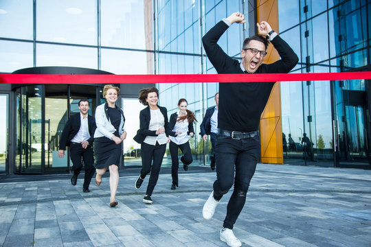 Business People Crossing The Finish Line