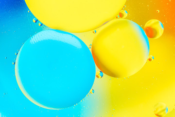 Beautiful color abstract background from mixied water and oil. Pastel colored abstraction. Yellow...
