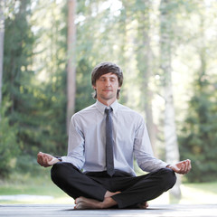 Businessman practicing yoga