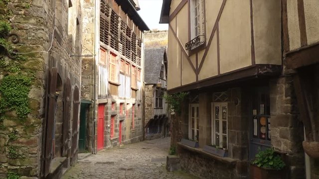 DINAN, FRANCE - APRIL 06, 2018: view of empty beautiful street with old traditional houses at the center of Dinan, Brittany, France
