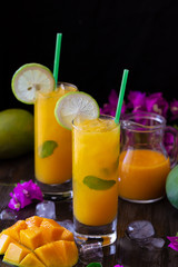 Summer mango cocktail with lime and mint